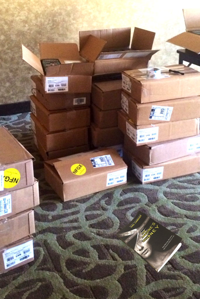 boxes of books to sing in hotel conference room