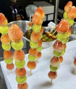 Candied Fruit on a stick Strawberry grape Bangkok Chinatown by Piper J Drake